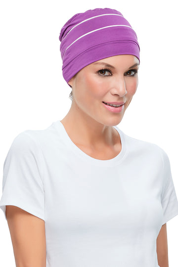 Woman wearing a purple Playful Softie Headwear for Women With Hair Loss